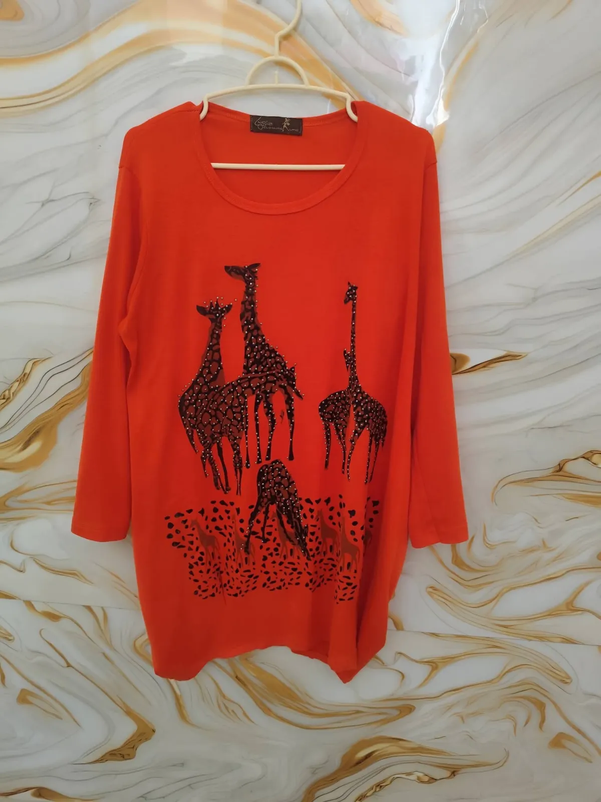 Women's top (blouse/tunic shirt) adorned with rhinestones